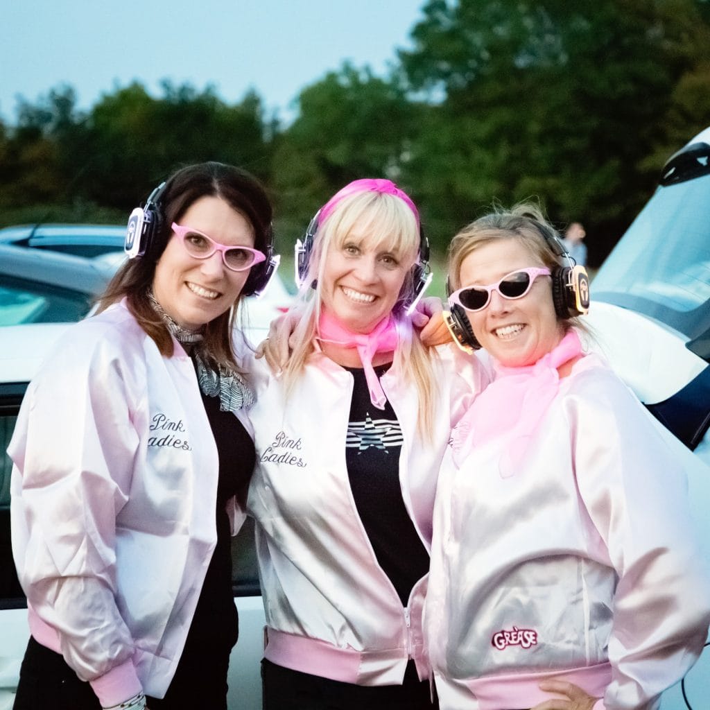 Enjoying a silent disco with a grease themed party